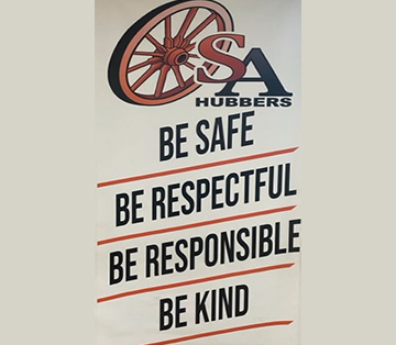 Banner on wall reading Be Safe, Be Respectful, Be Responsible, Be Kind